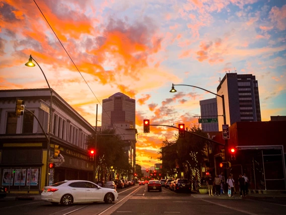 A photograph of sixth avenue at sunset