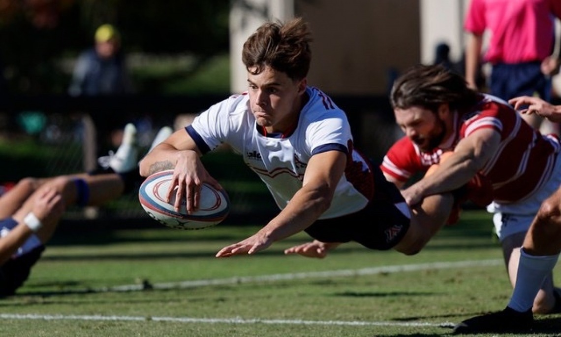 UA Rugby player diving for rugby ball